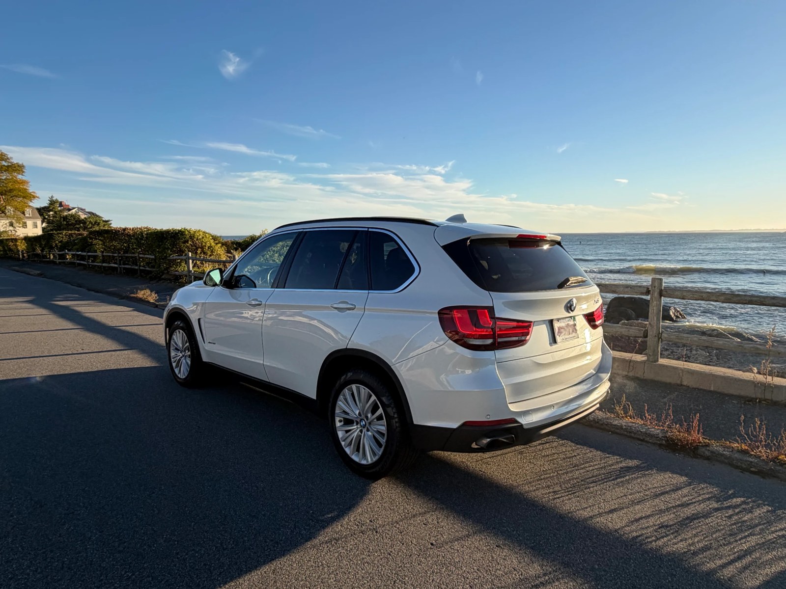 Rear three-quarter view, driver side, ocean behind